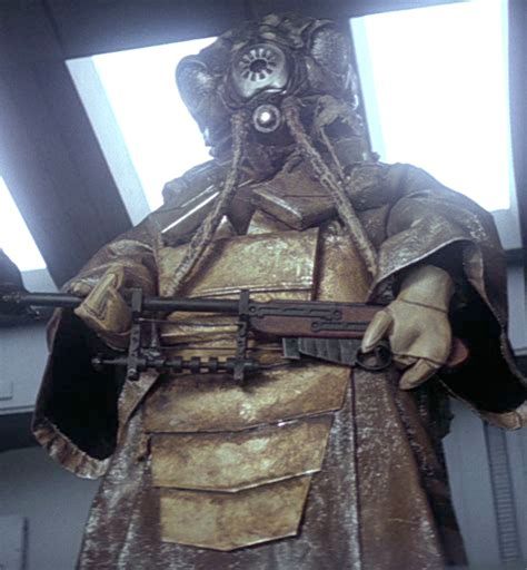 Screenshot of Zuckuss, a Gand bounty hunter, from The Empire Strikes Back.