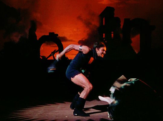 Gene Kelly strikes a menacing squat in The Pirate, wearing tiny little cut-off booty shorts to accentuate his tanned, tree trunk thighs. 