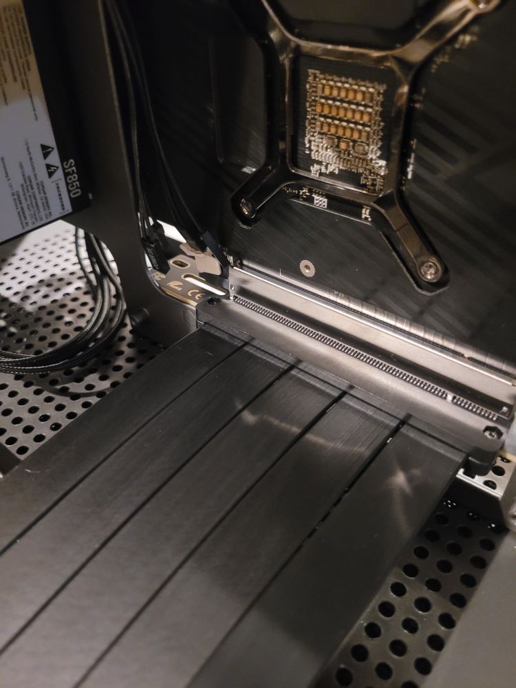 L-riser cable does not allow sufficient clearance to route the cable underneath the motherboard.