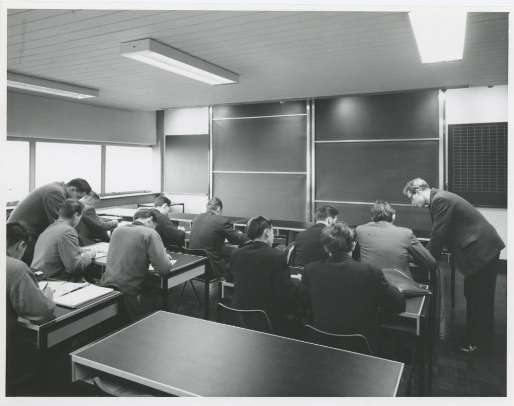 Photograph of students at desks in a seminar room in 1968.