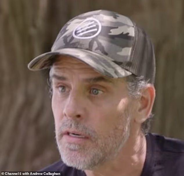 hunter biden wearing a camo cap with 3 arrows in a circle on it