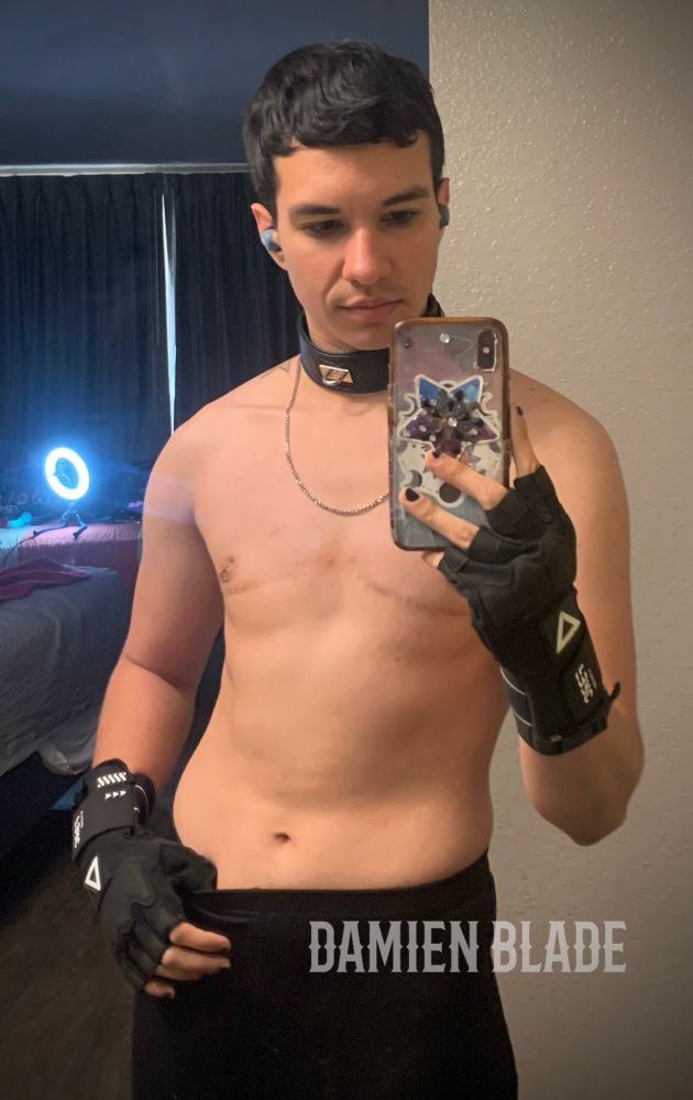 Damien blade ftm trans man porn star content creator on onlyfans and JustForFans posing shirtless in front of the mirror