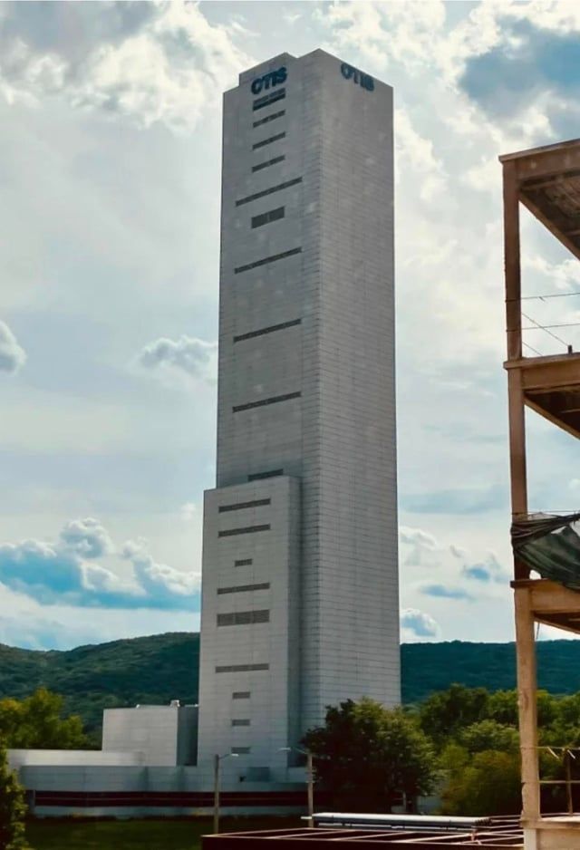 Otis test tower - unadorned industrial concrete tower 