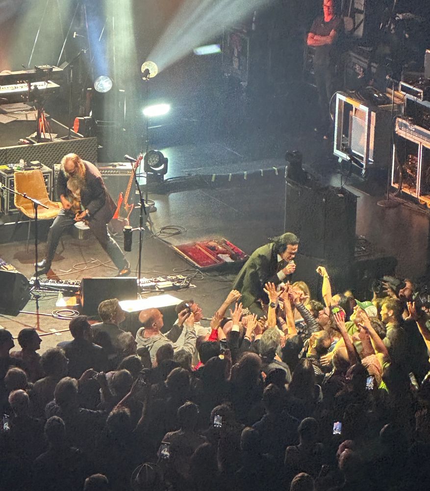 Nick Cave and Warren Ellis performing on stage in Toronto 