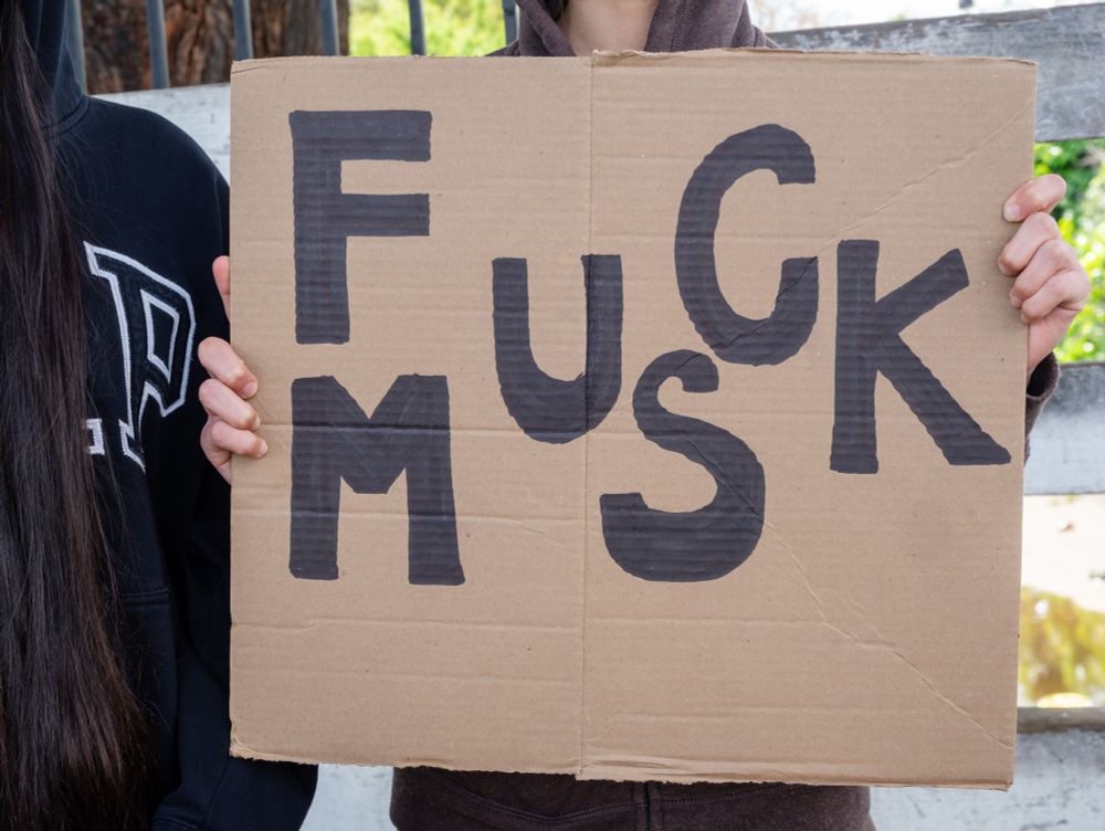 FUCK MUSK cardboard sign
