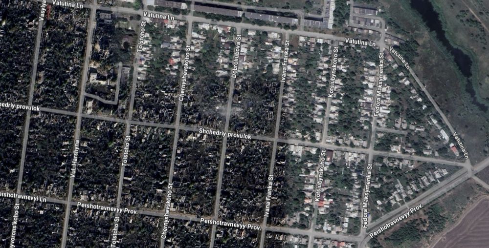 Satellite image of a neighbourhood that is half bombed out, half still standing
