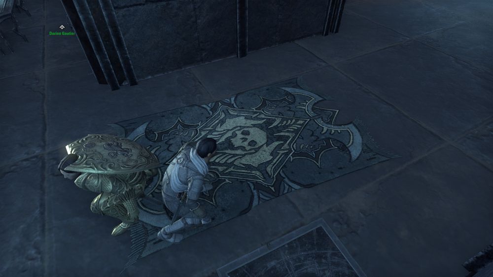 Screenshot of ESO with Jerrick looking at...a really creepy rug featuring the iconography of the Worm Cult and bones and spiky bits and general nastiness.