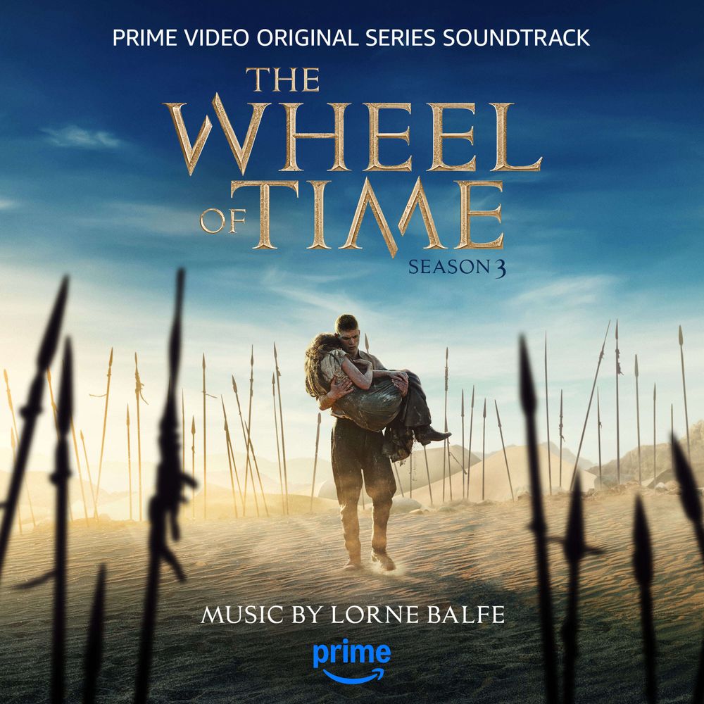 Cover art for The Wheel of Time Season 3 Original Series Soundtrack. The image features a dramatic scene with Rand al'Thor carrying an Moiraine through a desert landscape, surrounded by a field of upright spears. The title The Wheel of Time is prominently displayed in gold lettering, with “Season 3” written below. Above, the text reads “Prime Video Original Series Soundtrack,” and at the bottom, “Music by Lorne Balfe” is displayed. The Prime Video logo appears at the bottom center. The background features a vast desert with distant mountains, under a gradient blue and golden sky.
