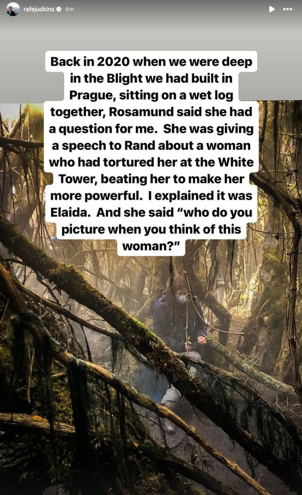 An image from the set of The Wheel of Time, featuring dense, misty foliage representing the Blight. Rosamund Pike, in character as Moiraine, is visible in the background among the twisted, moss-covered trees. The text overlay recounts a story from showrunner Rafe Judkins, describing a moment in 2020 when Rosamund, while preparing for a scene, asked him about the character Elaida, saying, ‘Who do you picture when you think of this woman?’ The scene captures the eerie and atmospheric set built in Prague. The full text of his post reads: Back in 2020 when we were deep in the Blight, sitting on a wet log together, Rosamund said she had a question for me. She was giving a speech to Rand about a woman who had tortured her at the White Tower, beating her to make her more powerful. I explained it was Elaida. And she said 'who do you picture when you think of this woman?'