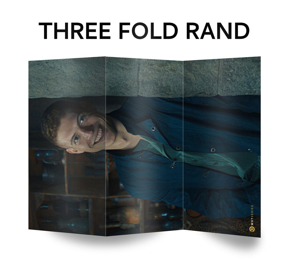 A meme featuring Josha Stradowski as Rand al’Thor from The Wheel of Time. The image is manipulated to resemble a three-panel folding brochure, with Rand’s face upside down and creased along the folds. The text above reads “THREE FOLD RAND,” a pun referencing the Three-Fold Land of the Aiel.