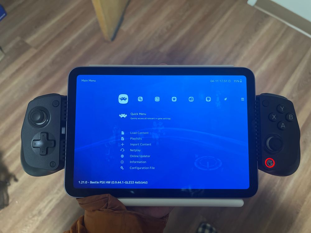 An ipad mini running retroarch with a controller attachment 