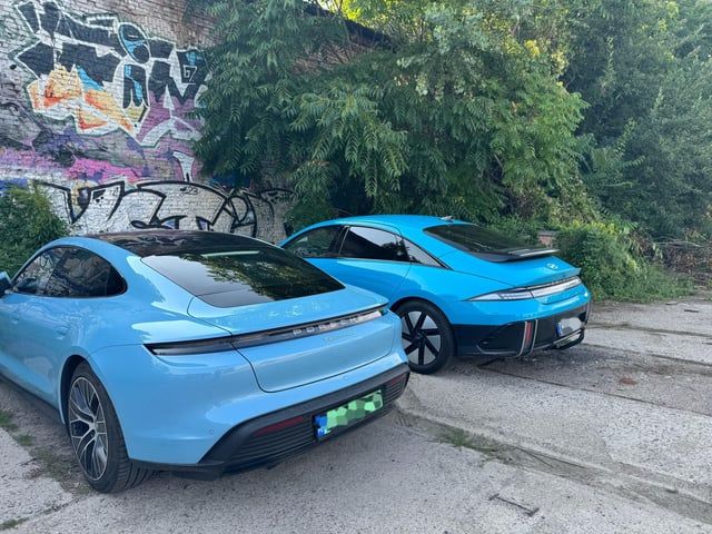 Porsche parked next to Ioniq 6
