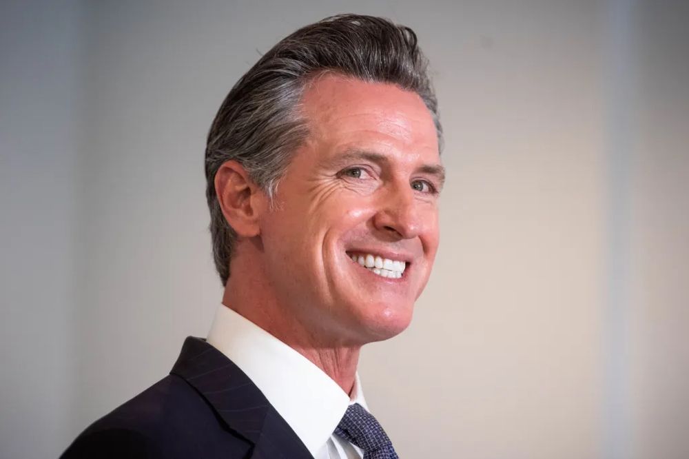 Gavin Newsom's creepy big grin and dead-eyed expression.