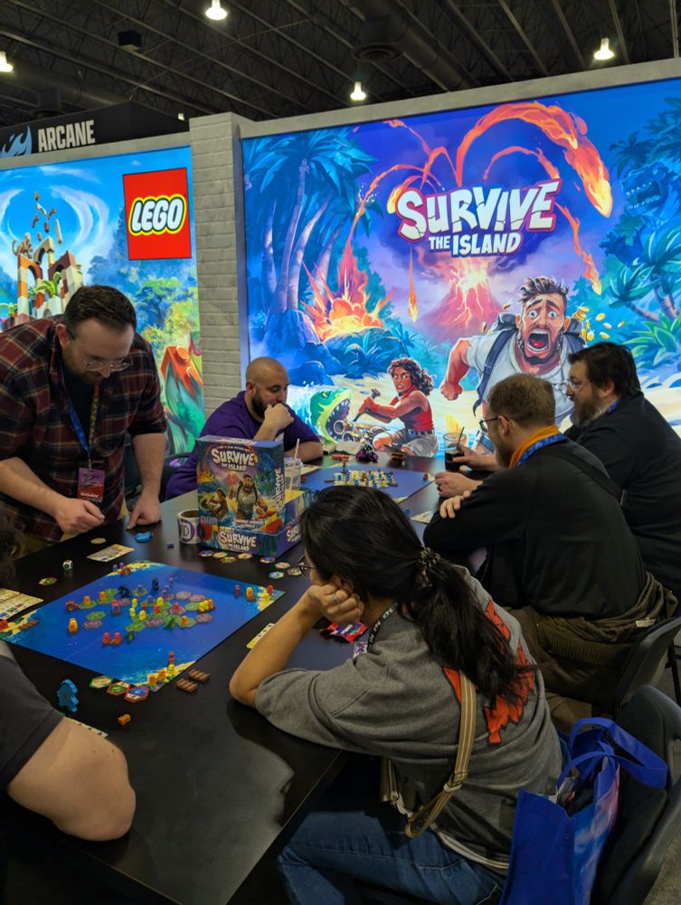 Photo of people playing Survive the Island at PAX Unplugged. 