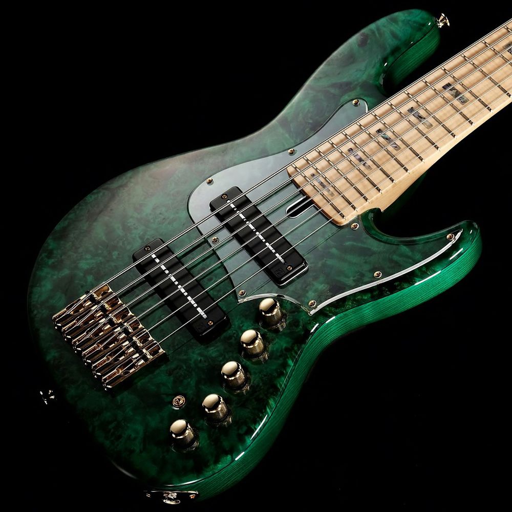 Clear pick guard on (probably) burl maple with green finish