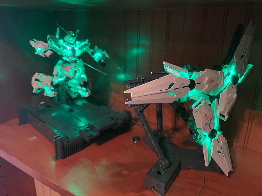 Unicorn Gundam gunpla lit up green.