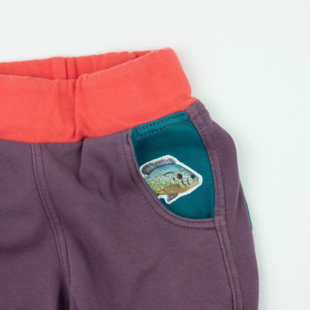 Visibly mended fish patch in pocket. 