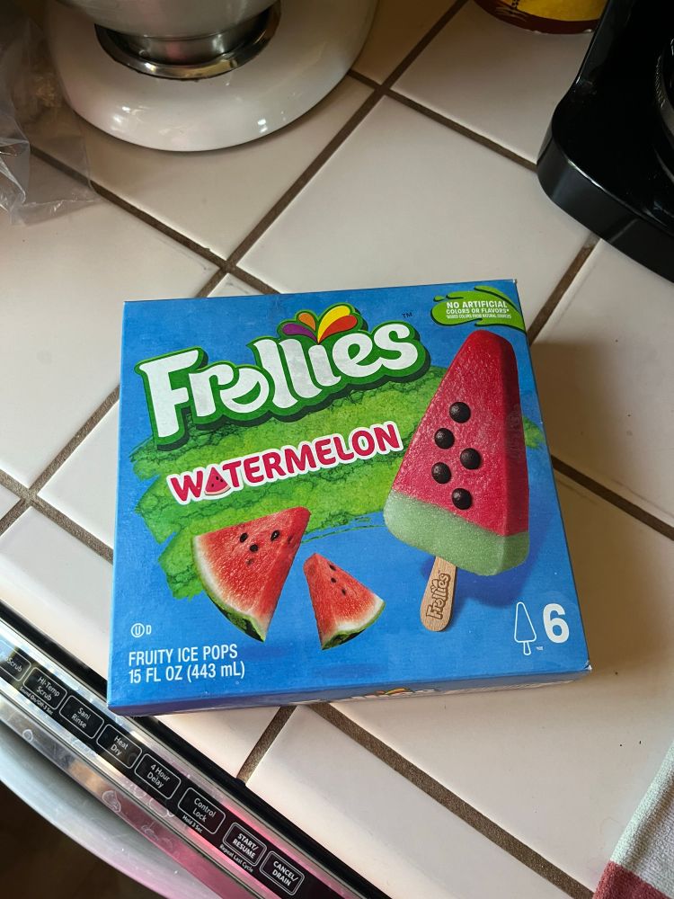 Photo shows a box of watermelon popsicles. 