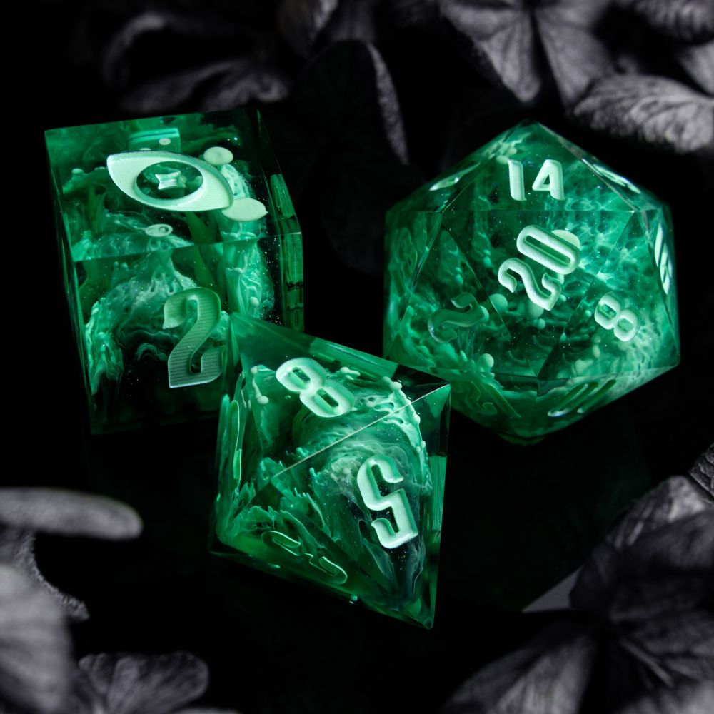 A ghostly green set on black background surrounded by gray flowers. The dice have detailed texture with pretty tendrils.

This picture features the D6, D8 and D20