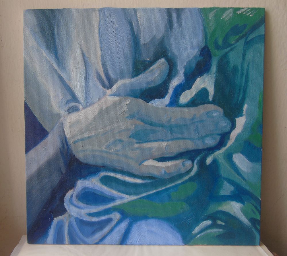 A veiny hand against an abstract surface painted in blues and greens. 