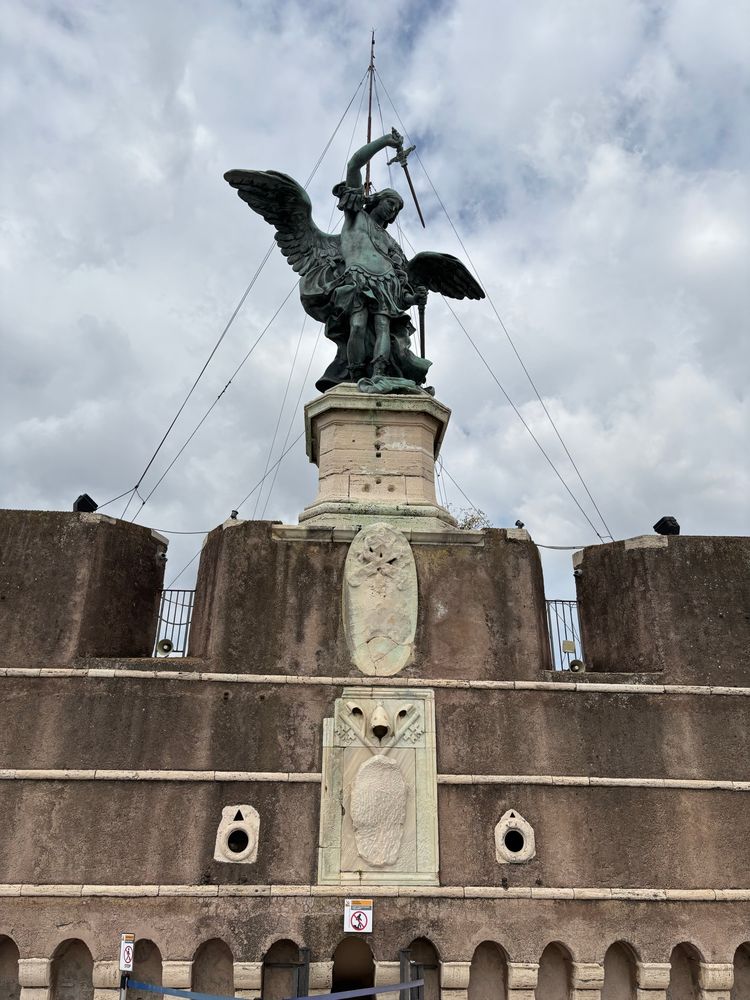 Bronze statue of archangel Michael on top of Castel Sant Angelo in Rome. 
