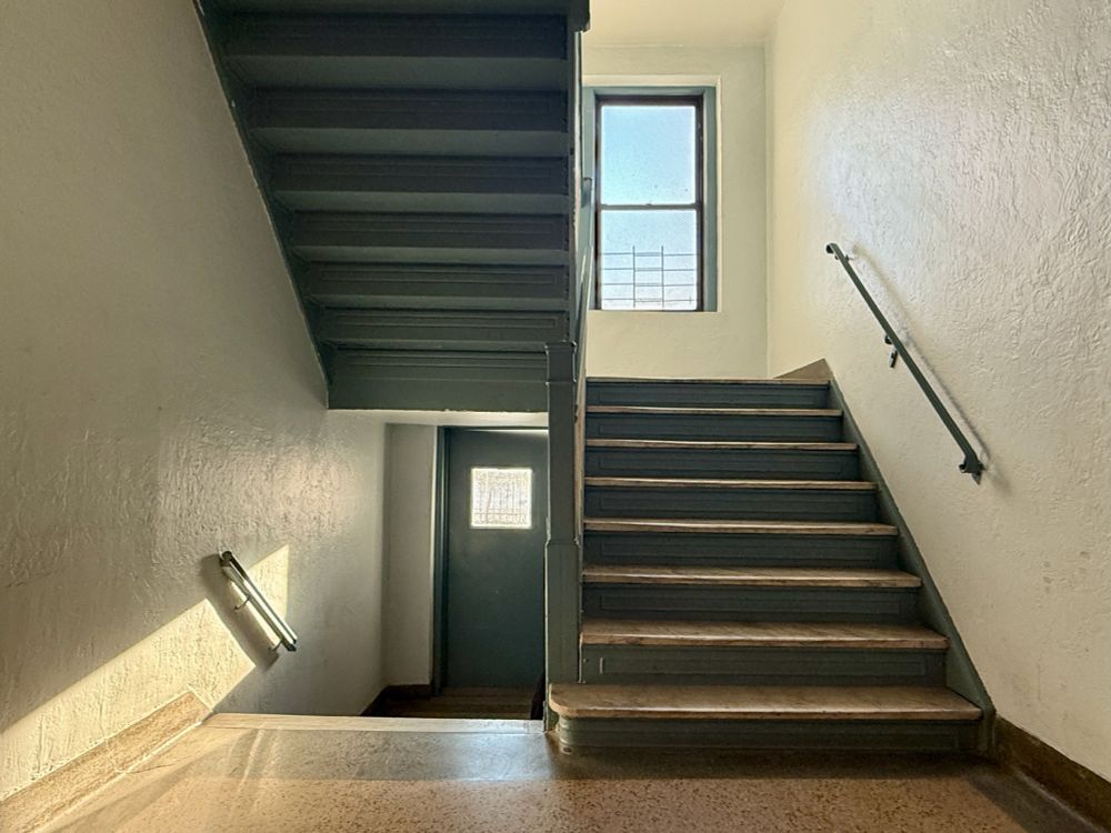 A New York stairwell, lit by early morning, sun.