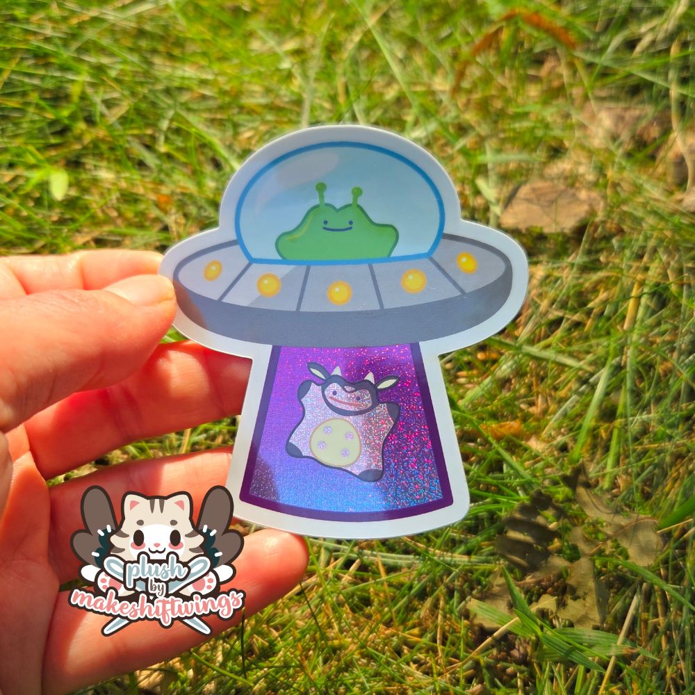 A sticker of an alien ditto in a ufo beaming up a ditto miltank