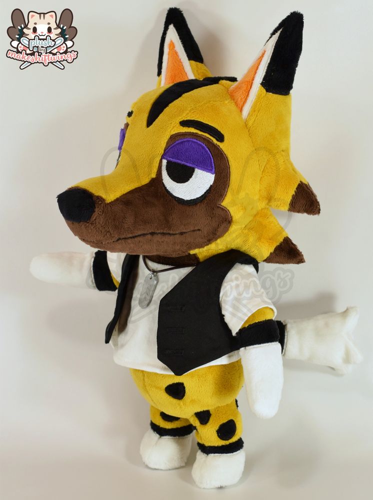 A plush of kyle from animal crossing, who is a yellow, brown, and black wolf wearing a black vest with white shirt