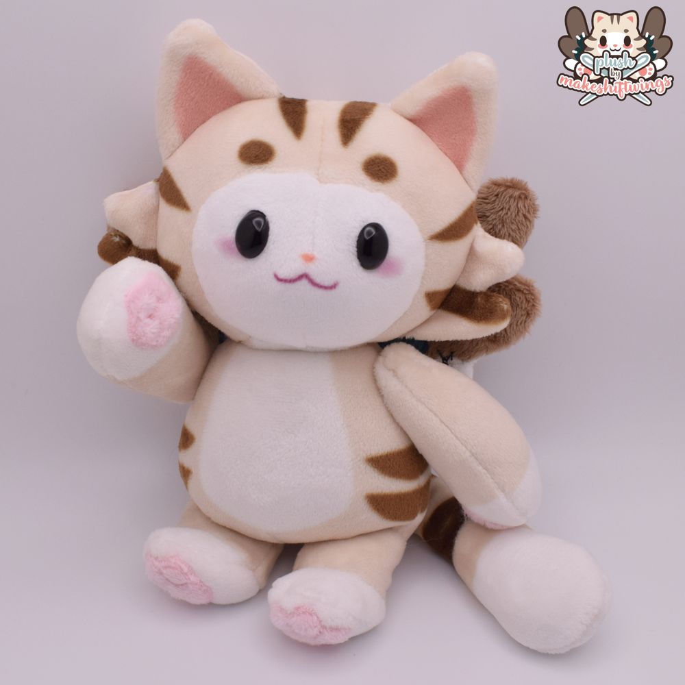 A very chubby plush of an anthropomorphic cat