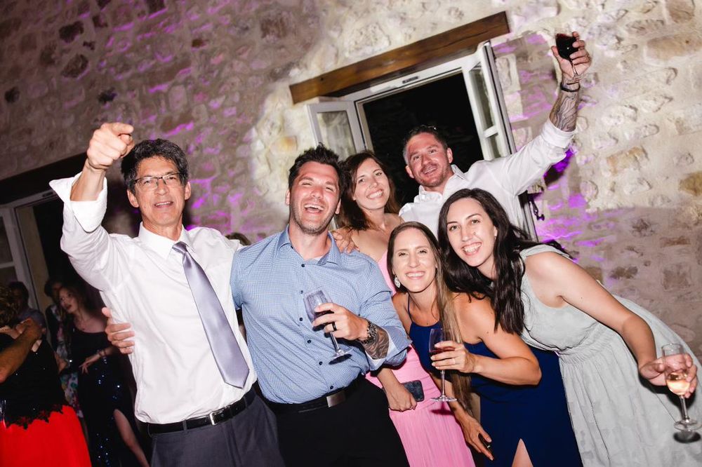 Group of people drinking and having fun at a wedding