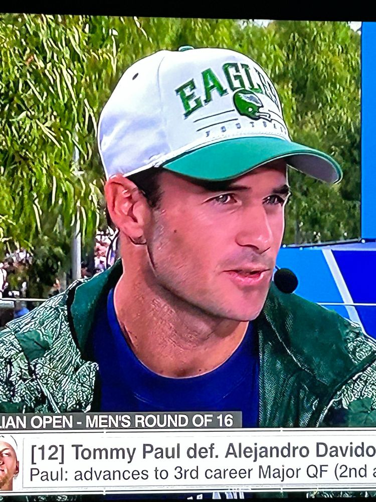 Tommy Paul wearing an Eagles hat after winning his Australian Open round of 16 match.
