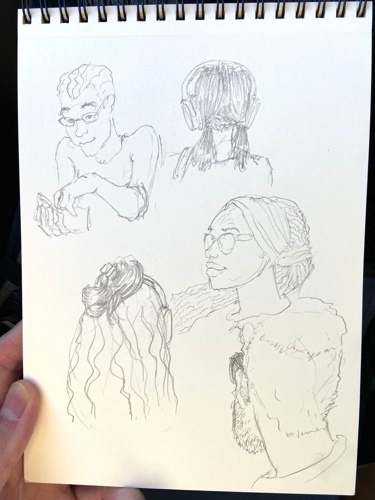 A sketchbook page with sketches of people drawn on a bus