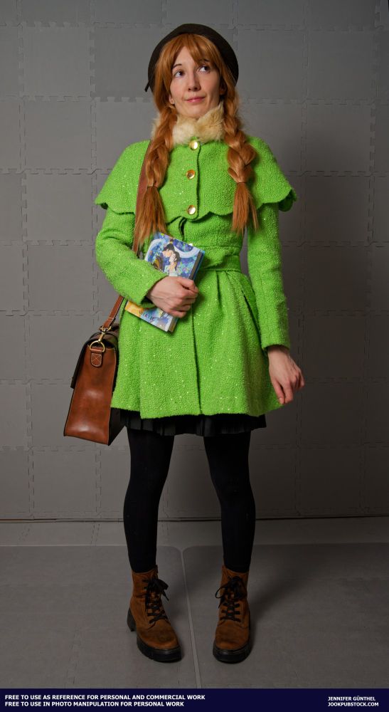 drawing reference photo of a model wearing a cute autumn outfit with a green coat and brown hat