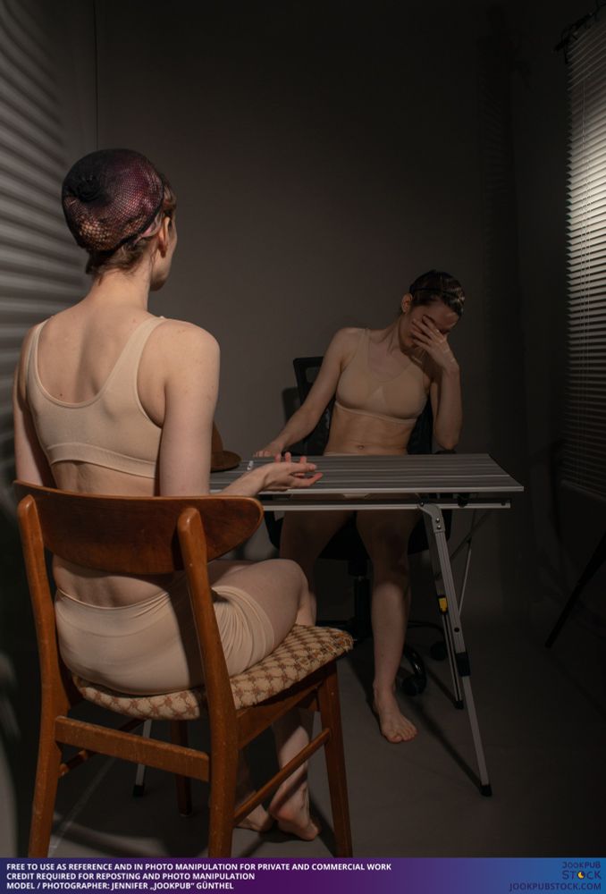 drawing reference photo of a model sitting a desk