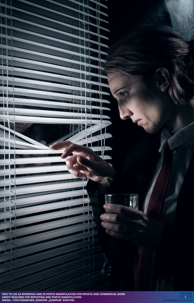 drawing reference photo of a model looking through a window, holding a glass