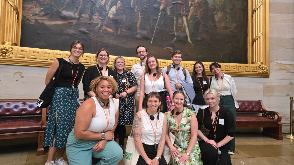 CSPI interns and staff pose in front of a painting in the rotunda of the U.S. Capitol building.
