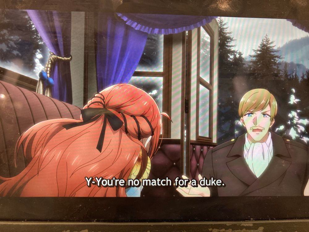 The first of two screenshots from “Pass the Monster Meat, Milady”, in this cut Mel’s hair is twisted and tied back with ribbon and a bow. The bow seams oddly thick compared to the rest of the ribbon which first caught my attention. 