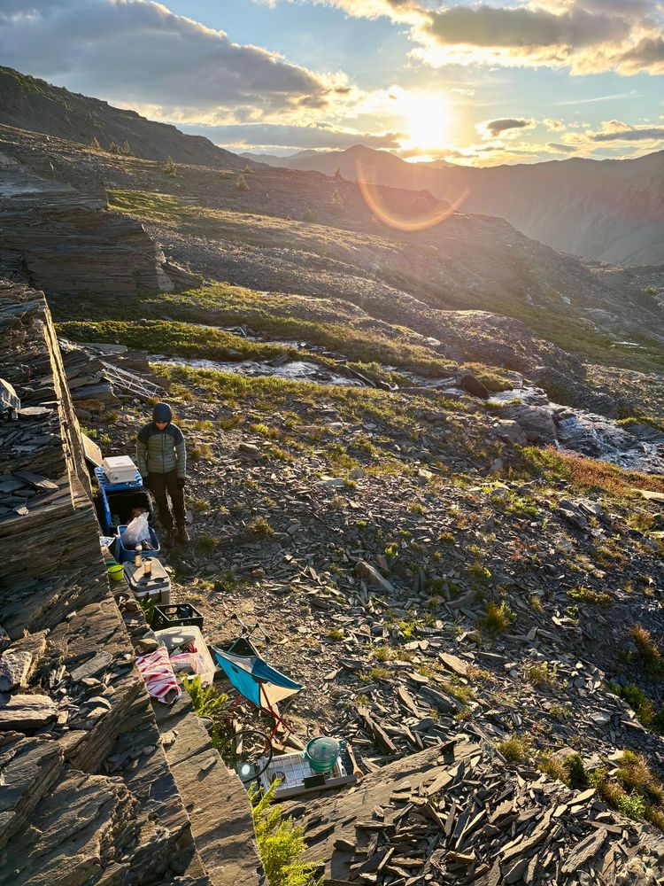 The camp kitchen, tucked up against a small rock wall, in the morning light