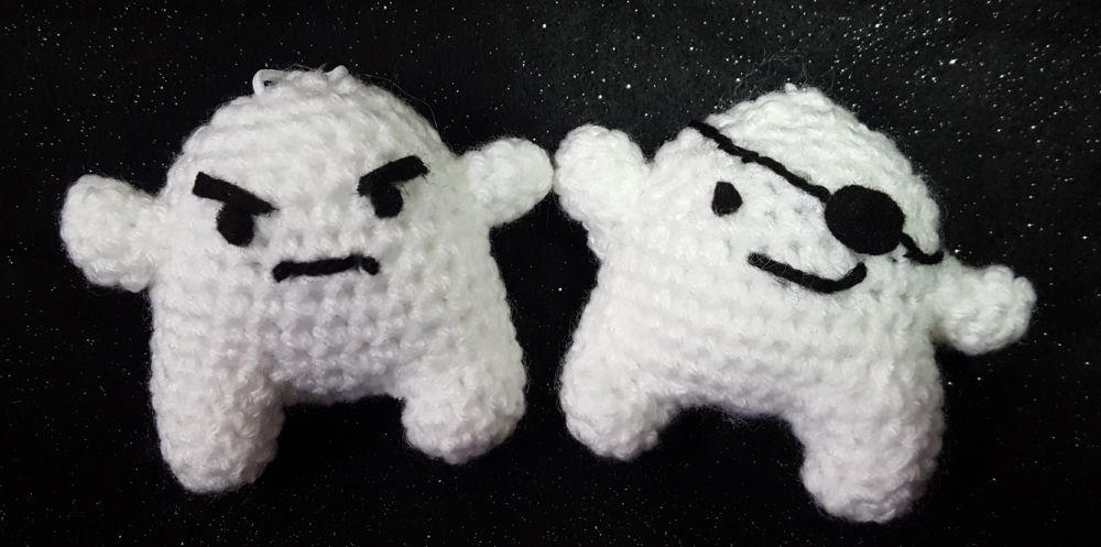 Photo of the ghost avatars from Yakuza 0. They represent Kiryu (left) and Majima (right) as featured from the Disco minigame. They are posing in front of a black glittery background