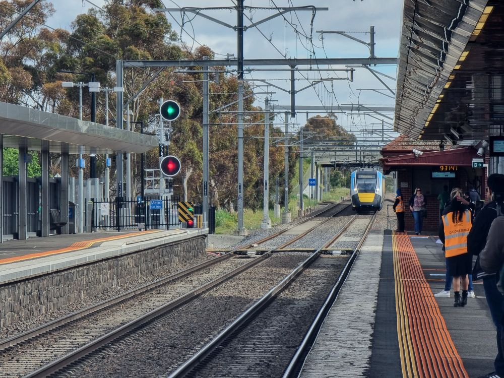 HCMT train approaches the platform at Diggers Rest station