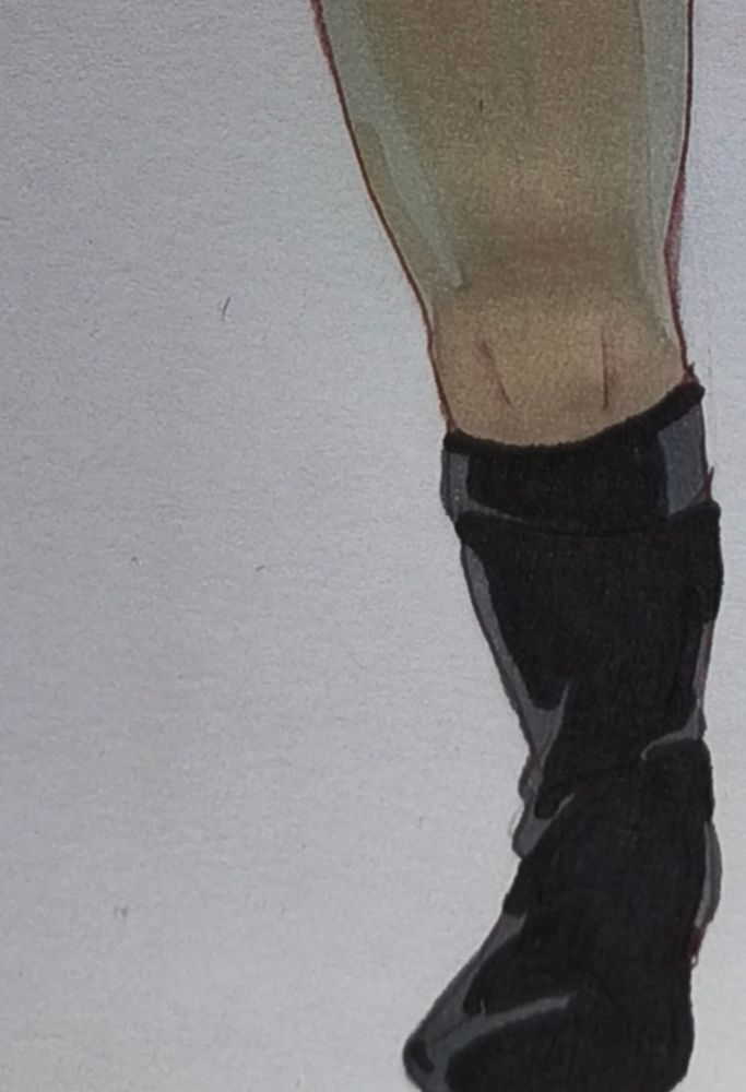 Left leg of Chibi!Uhura (ST: TOS). Bit of light gray and brown for her tights, dark gray and black for her shoe. Line drawn using a red ink ball pen.