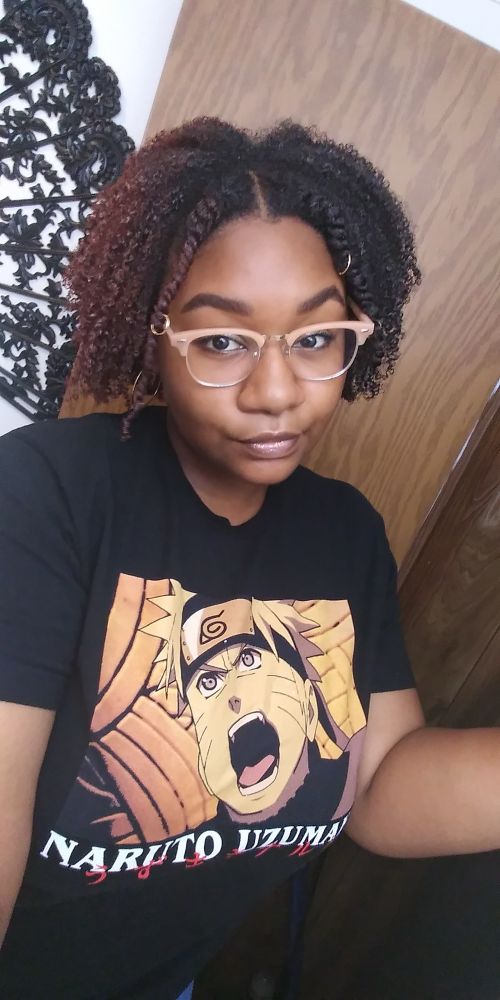 Me in 2020 with a fluffy, jaw length, half burgundy half brown fro with two front twists and hair rings. 