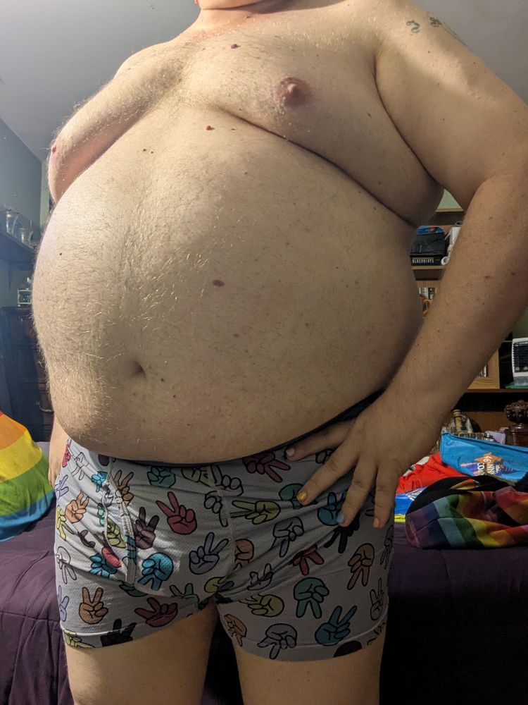 A chubby white person in their boxers 