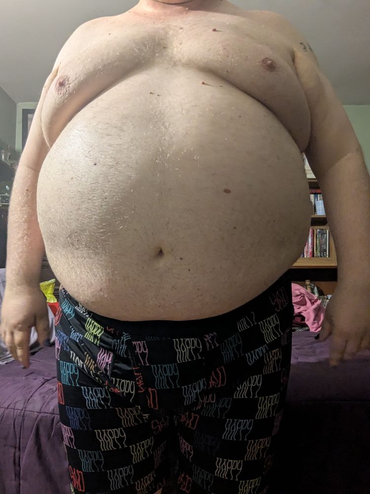 A chubby white person in their boxers 