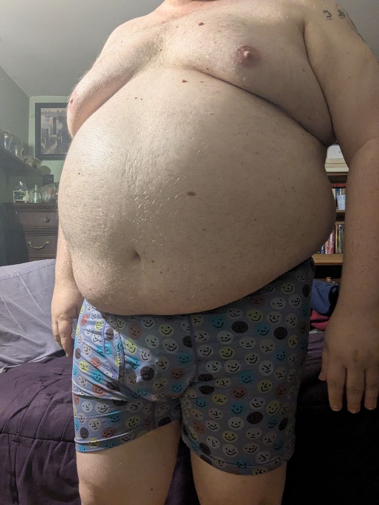A chubby white person in their boxers 