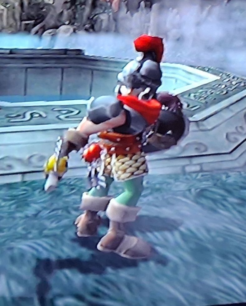 Photo of Maximo in the first hub world in misty spooy location. He is wearing plate armor reminiscent od roman armor and looking behind him while his lower body is facing the other way