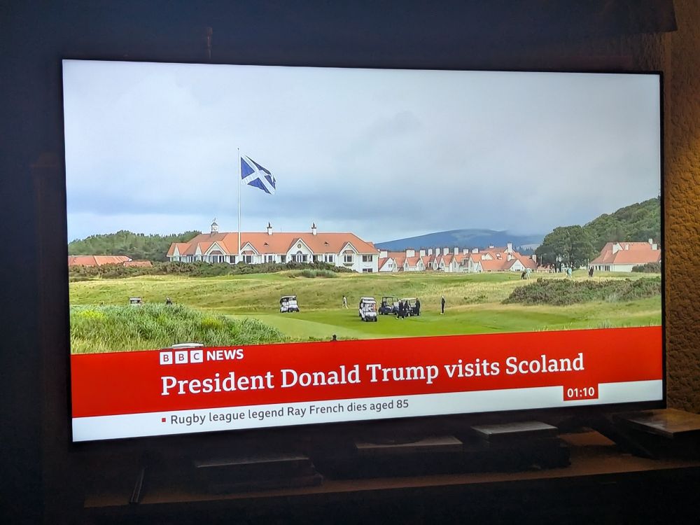 Picture of a TV news headline : President Donald trump visits scoland