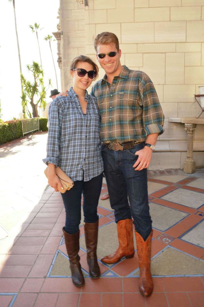 Joe Lonsdale wearing tight jeans tucked into knee-high cowboy boots. His shirt is a normal size for an average man but it’s baggy on him because he doesn’t have an ounce of muscle mass. The ideal masculine stereotype these dork ass losers froth over couldn’t possibly be more different from this absolute dweeb’s body type. 

A woman is standing next to him wearing almost the exact same thing, further proving my fucking point.