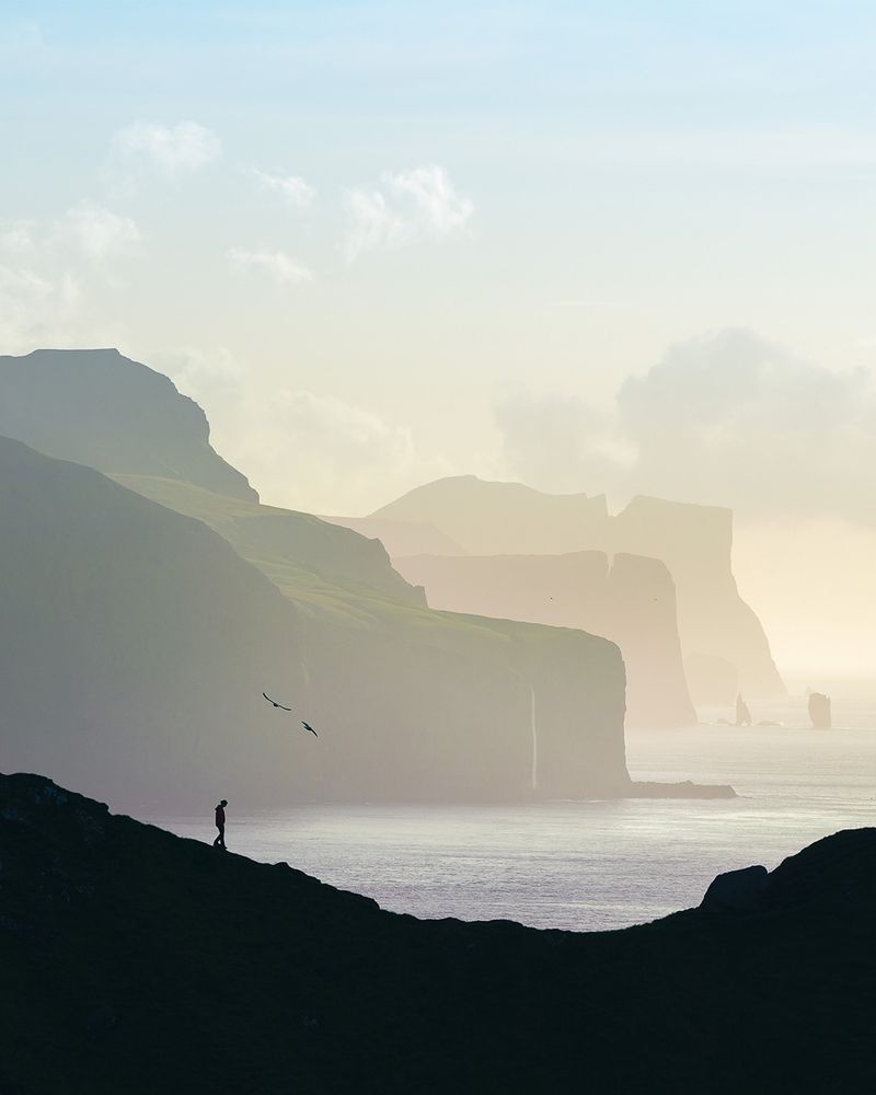 A person hiking on Kalsoy, Faroe Islands.