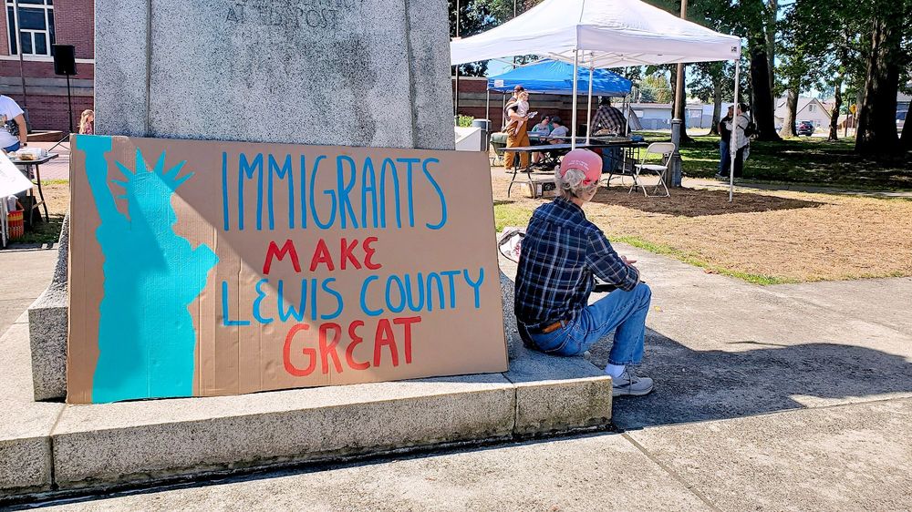 Centralia Washington, large protest sign, Immigrants Make Lewis County Great, depiction of lady liberty, photo taken at George Washington Park